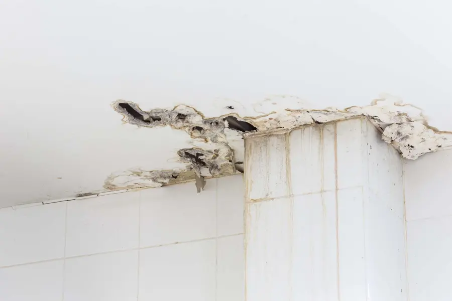 Ceiling drywall cracked and stained by a leak from the floor above in a Mission Viejo home