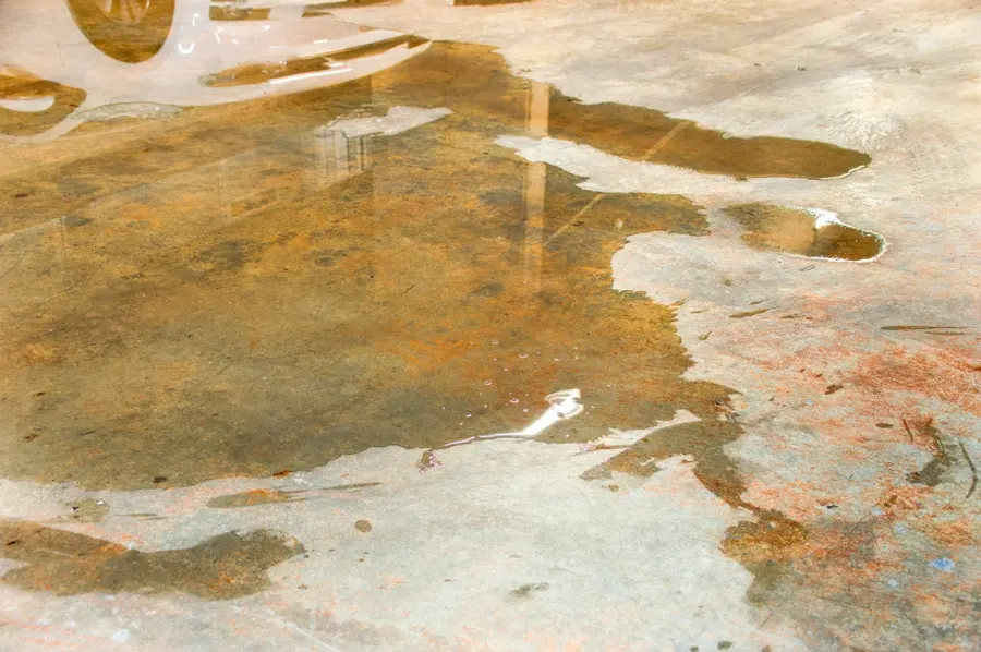 Water spreading across a concrete slab floor from a slab leak in Mission Viejo, CA