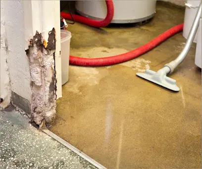 Extraction hose and floor wand pulling standing water off a wet floor in Mission Viejo